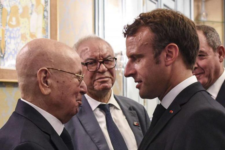 French President Emmanuel Macron (R) meets with Algeria’s interim President Abdelkader Bensalah in Tunis