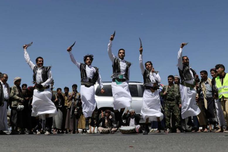 Huthi supporters perform the traditional Baraa dance during a ceremony held to collect supplies for Huthi fighters in Sanaa