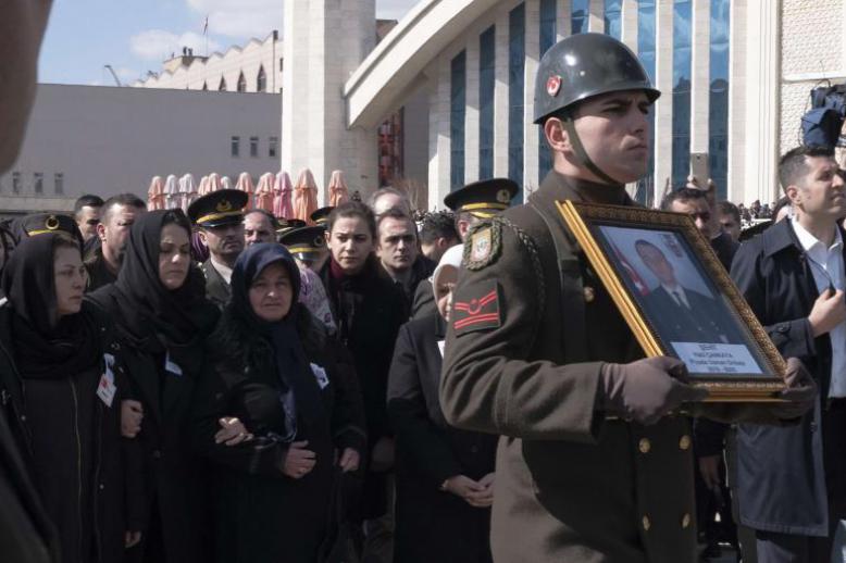 Family members attend a funeral ceremony in Ankara, March 1, for one of the Turkish soldiers killed in Idlib