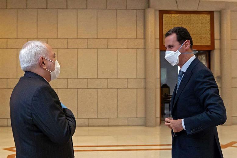 Syrian President Bashar Al-Assad (R) meeting Iranian PM Mohammad Javad Zarif