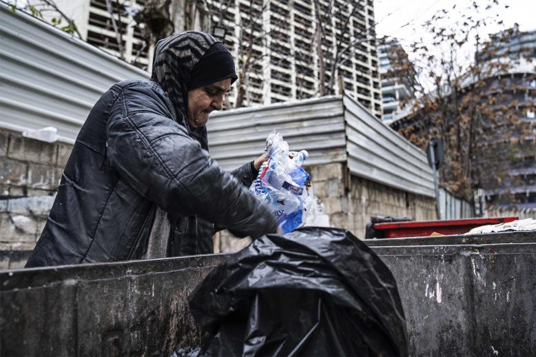 Scavenging through trash to survive