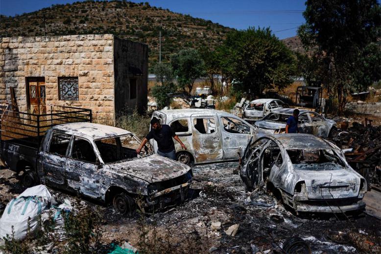 Burnt vehicles after Israeli settlers attacked near Ramallah in the Israeli-occupied West Bank last month