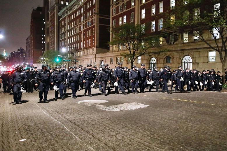 NYPD officers in riot gear march onto Columbia University campus