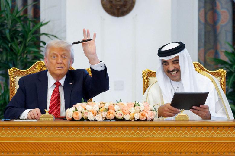 US President Donald Trump and Qatar's Emir Tamim bin Hamad Al Thani attend a signing ceremony in Doha