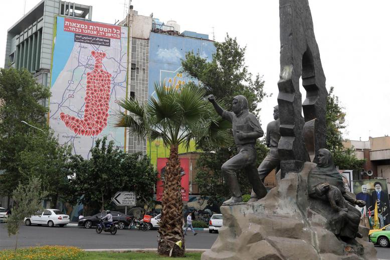 An anti-Israel billboard featuring the shape of a traditional Yemeni dagger made of map pins and sentences reading All targets in Israel are within reach