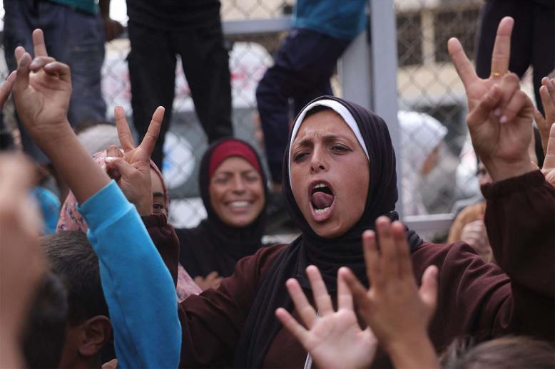 Palestinians celebrate in Deir al-Balah in the Gaza Strip following news of a new Gaza ceasefire deal