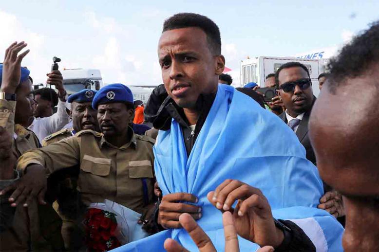 Artan is received as he arrives at the Aden Abdulle Osman International Airport in Mogadishu