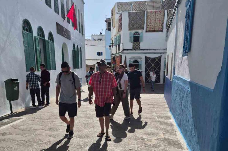Tourists walking in the medina of the northern city of Assilah