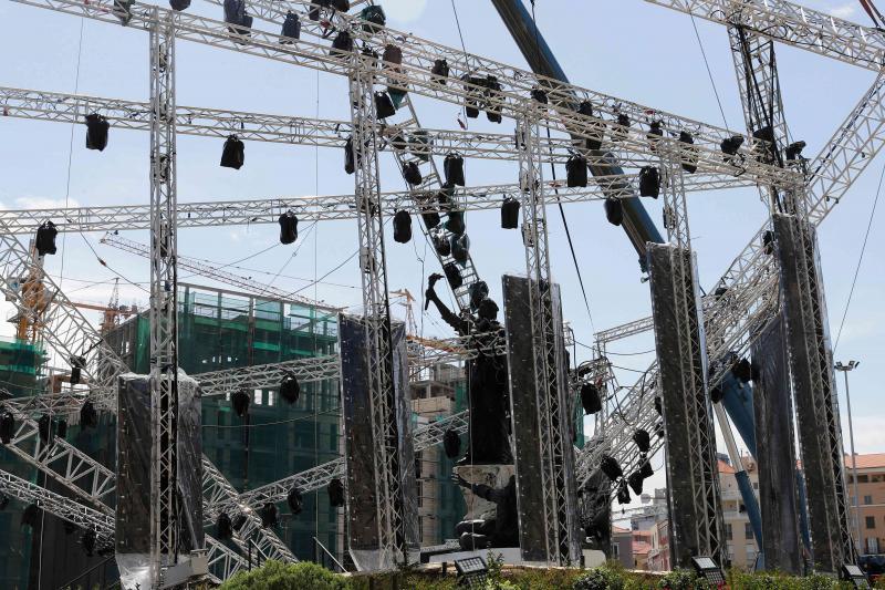 A stage that was set to celebrate the results of the parliamentary elections is seen collapsed on top of Martyrs statue, on May 8