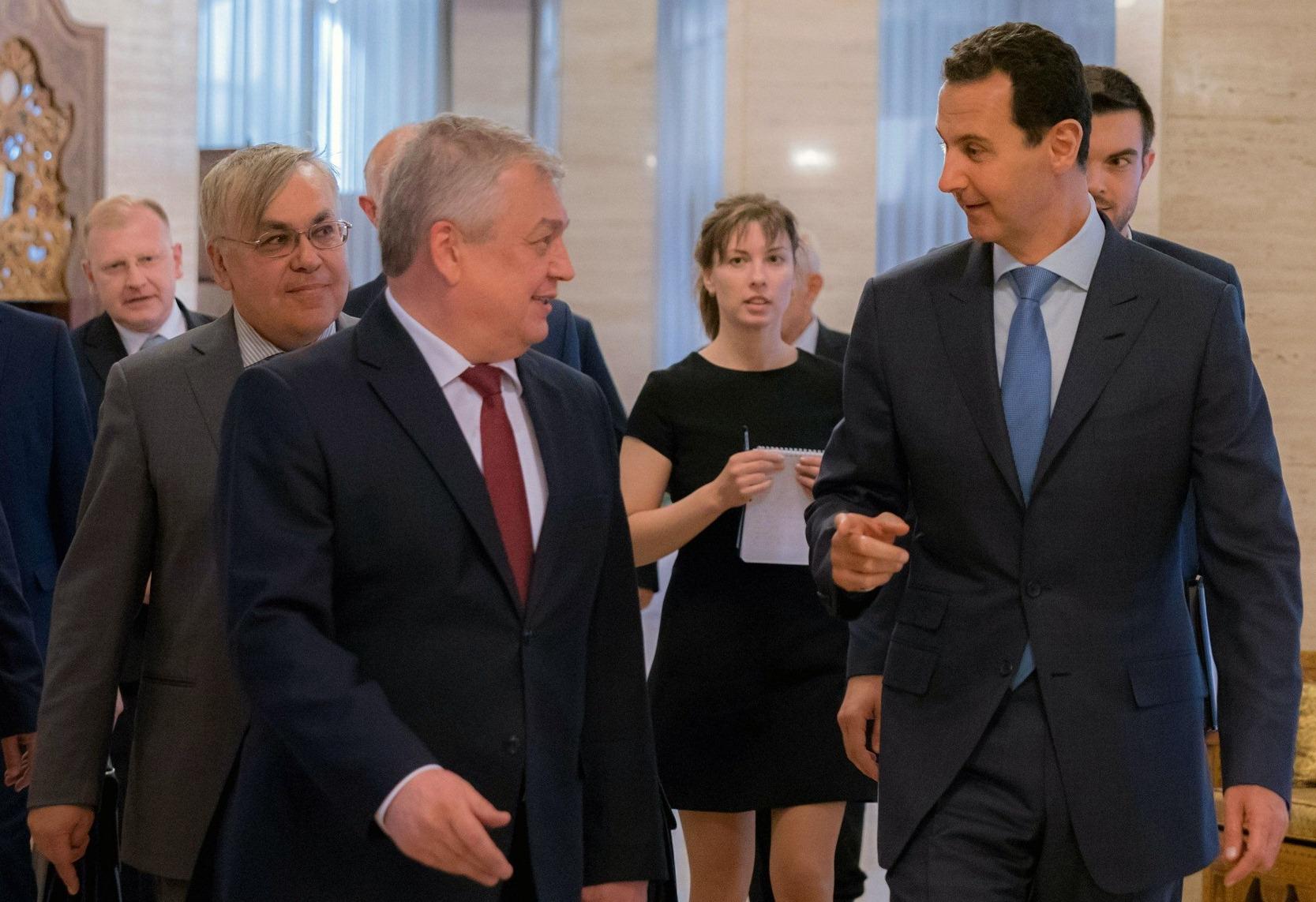 الرئيس السوري بشار الاسد مع موفد الرئيس الروسي 
