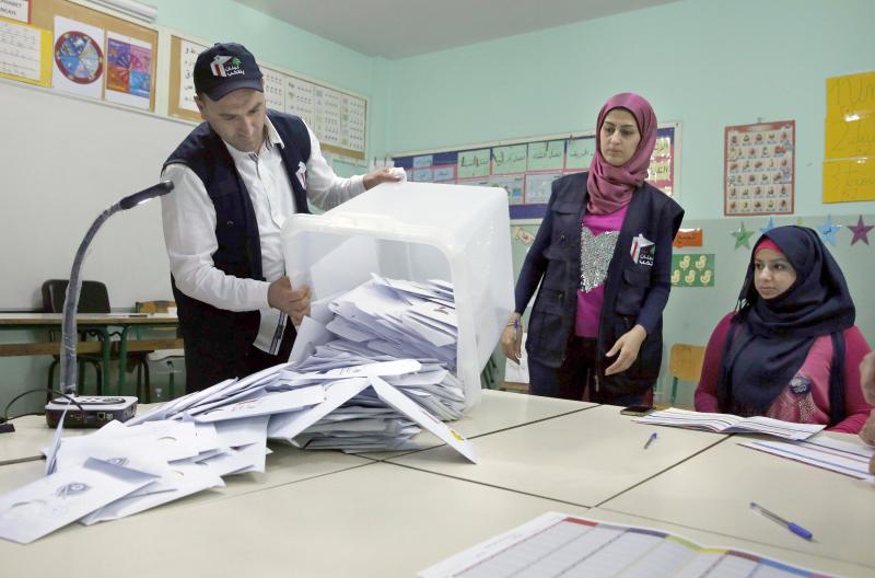 Election officials prepare to count ballots shortly after the polling stations closed in Beirut, on May 6