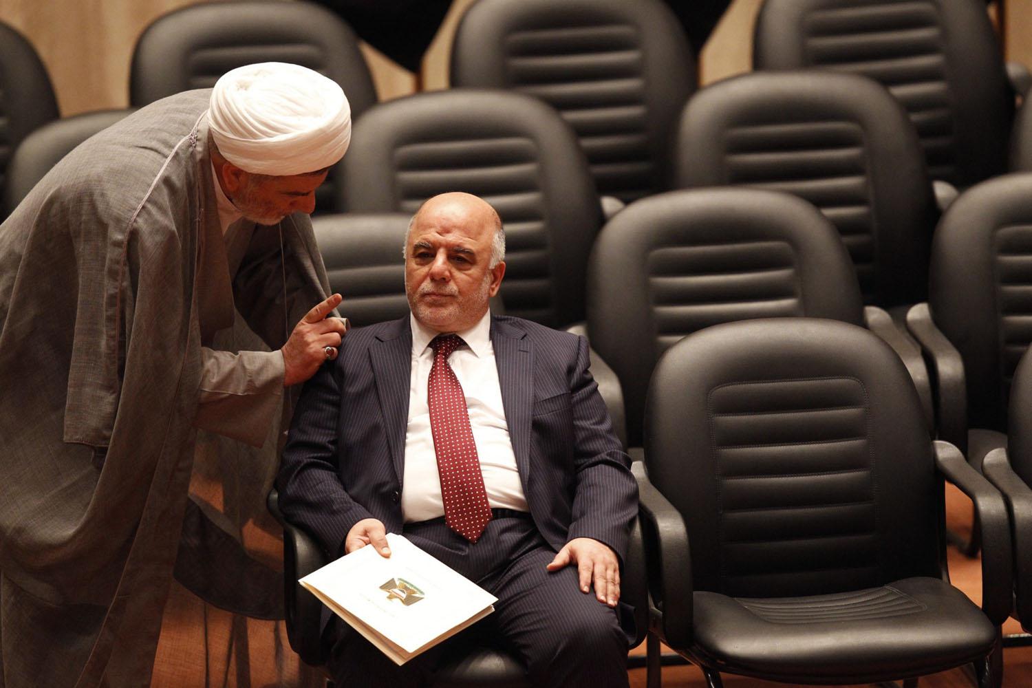 همام حمودي يتحدث إلى رئيس الوزراء العراقي حيدر العبادي