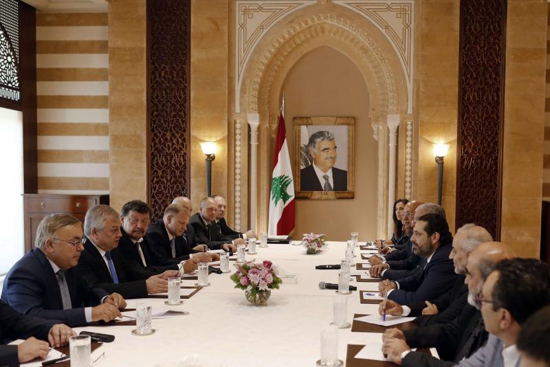 Lebanon’s Prime Minister-designate Saad Hariri (C-R) meets with Russia’s special presidential envoy to Syria Alexander Lavrentiev (2nd L) at his house in downtown Beirut, on July 26