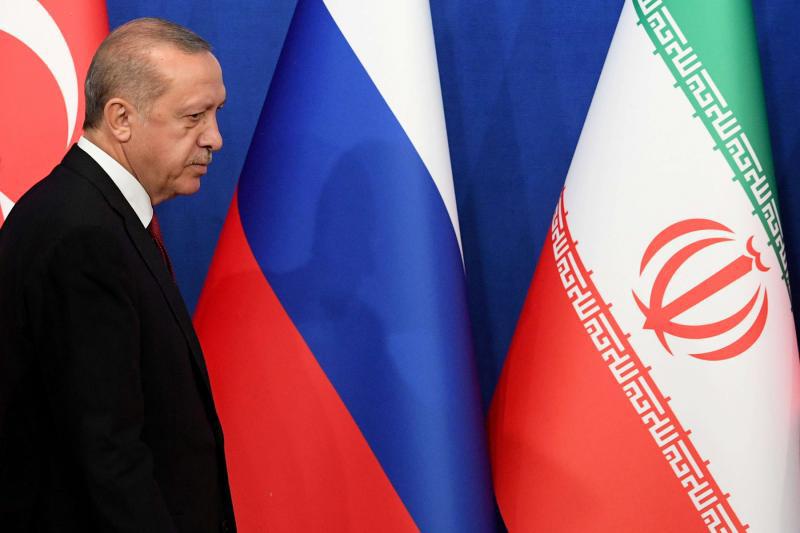 Turkish President Recep Tayyip Erdogan arrives for a news conference in Tehran, on September 7