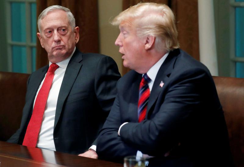 US Defense Secretary James Mattis listens (L) as US President Donald Trump speaks at the White House in Washington, on October 23