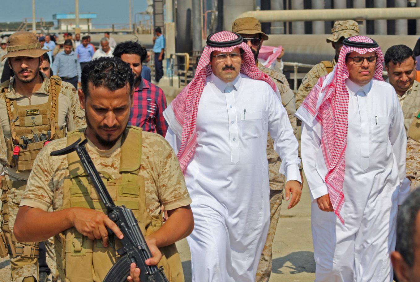 Saudi ambassador to Yemen Mohammed Said Al-Jaber (C) arrives in the southern Yemeni port of Aden to oversee an aid delivery of fuel from Saudi Arabia on October 29, 2018.