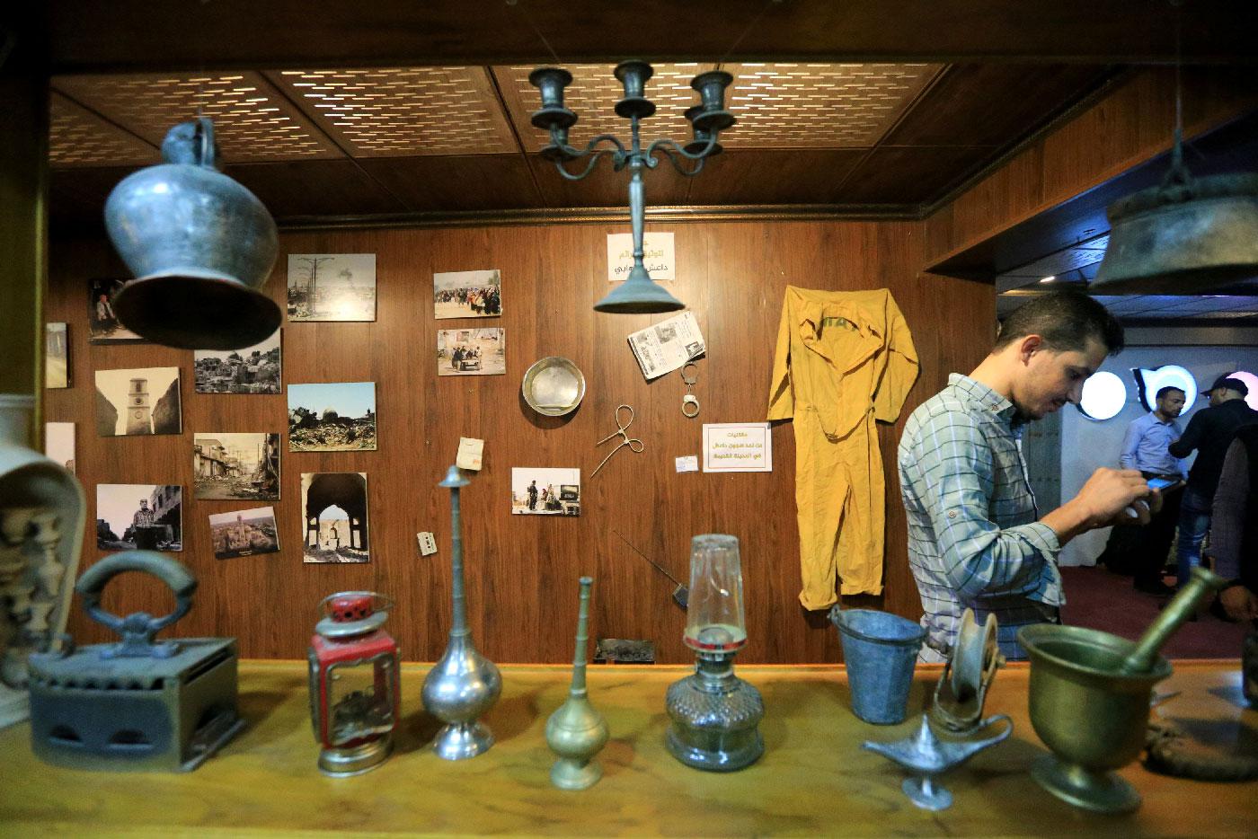 Items related to Islamic State militants are seen displayed on the wall of Qantara Culture Cafe in Mosul, Iraq October 26, 2018.