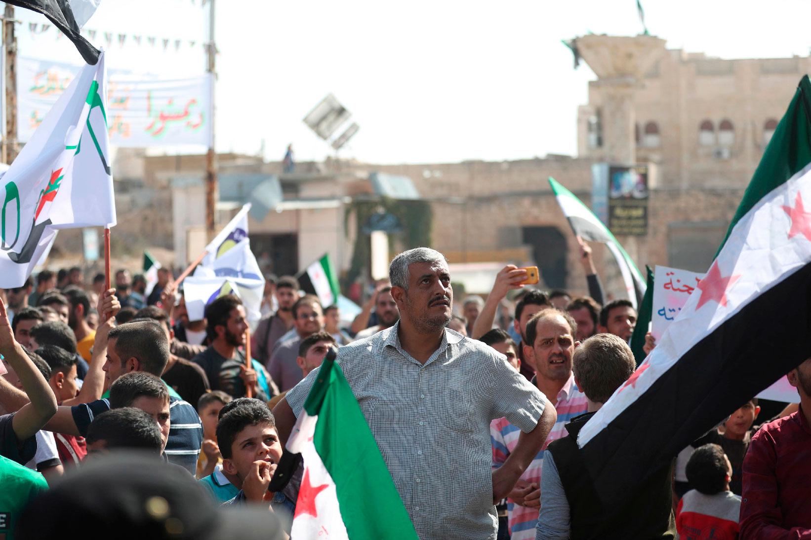 Bahr Nahhas (C) attends a demonstration in the rebel-held town of Maaret al-Numan, in the north of Idlib province on October 19, 2018.