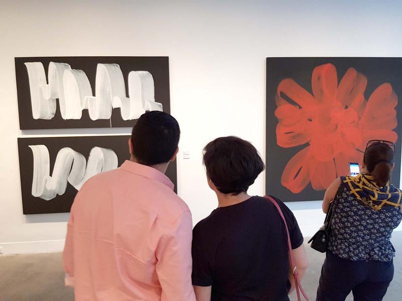 Visitors look at paintings at L’Atelier 21 gallery in Casablanca