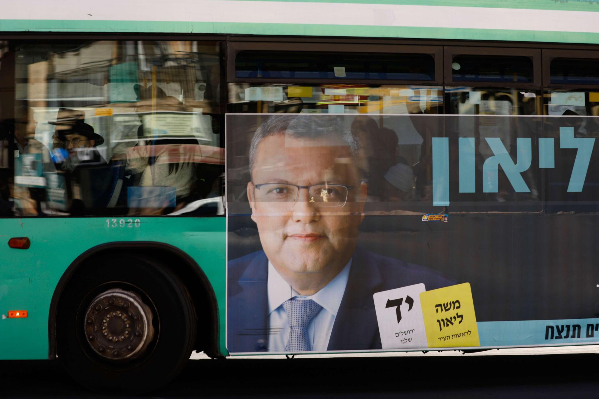 A campaign poster of municipal candidate Moshe Lion on a bus ahead of the upcoming Jerusalem municipal elections, in Jerusalem.