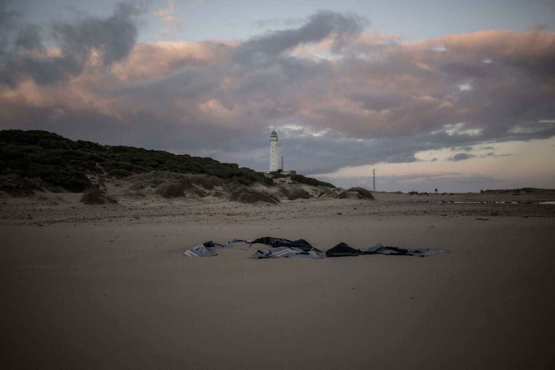 Remains of a dinghy lies on the beach near the village of Canos de Meca in southern Spain, Tuesday, Nov. 6 2018