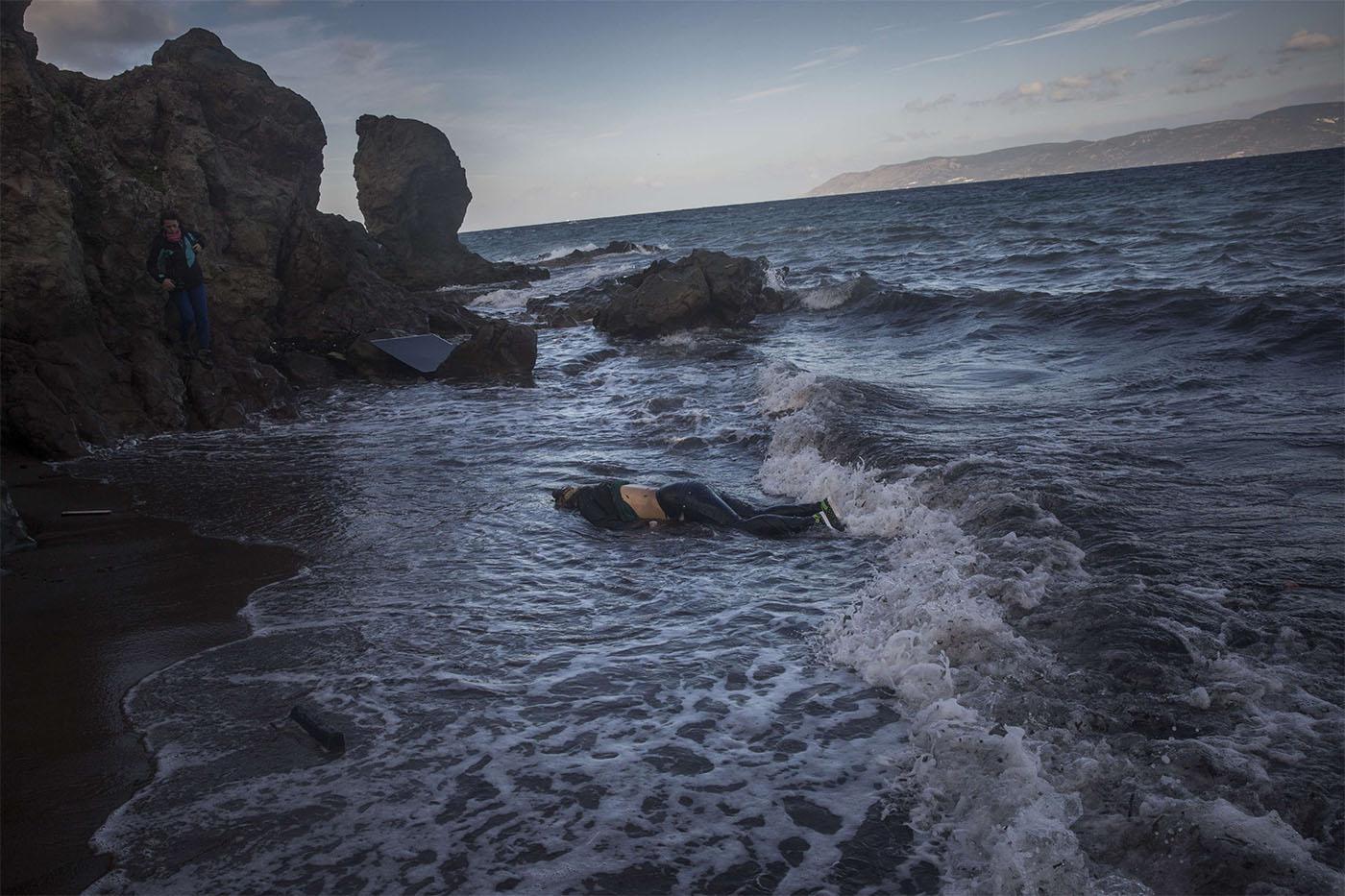 the body of an unidentified woman washes up on a beach at the village of Skala, on the Greek island of Lesbos