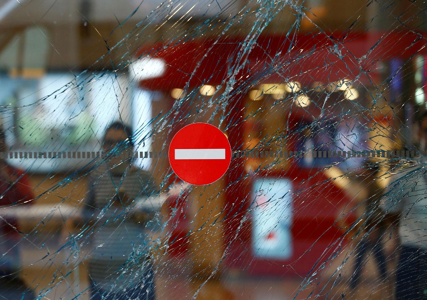 A broken window is seen at Turkey's largest airport, Istanbul Ataturk, Turkey, a day after an attack which killed 45 people, June 29, 2016.