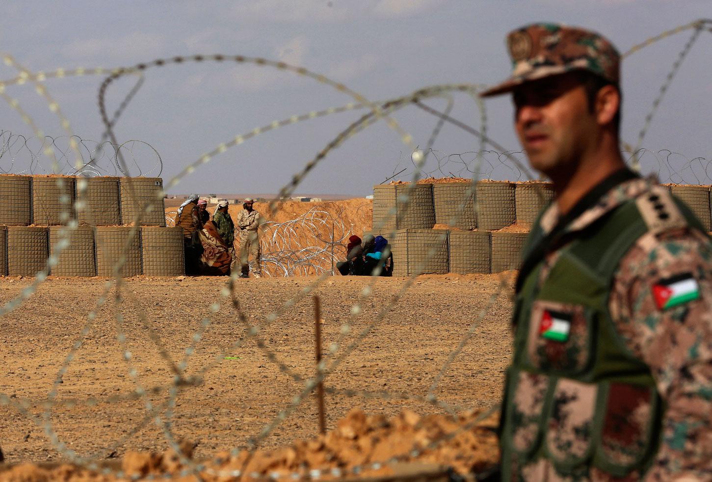 Jordanian soldier stands at the north eastern border with Syria, close to the informal Rukban camp.