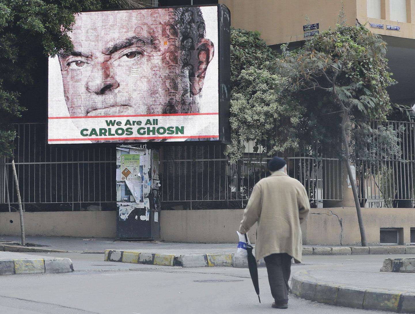 A portrait of former Nissan chief Carlos Ghosn is seen on a billboard in his support at a street in Beirut on December 6, 2018.