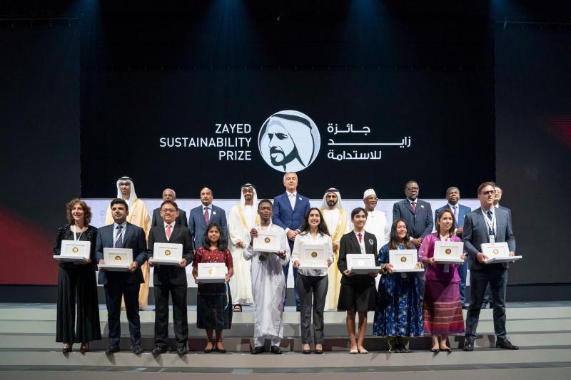 Abu Dhabi Crown Prince Sheikh Mohammed bin Zayed al-Nahyan (2nd row, 4th L) and UAE Vice-President Sheikh Mohamed bin Rashid Al Maktoum (2nd row, 6th L) pose with the winners of the Zayed Sustainability Prize for Energy.