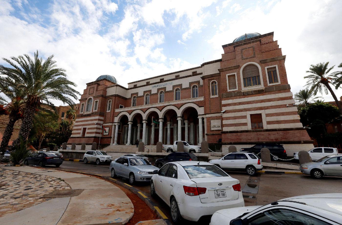 Cars are parked outside the Central Bank of Libya in Tripoli, Libya November 14, 2017.