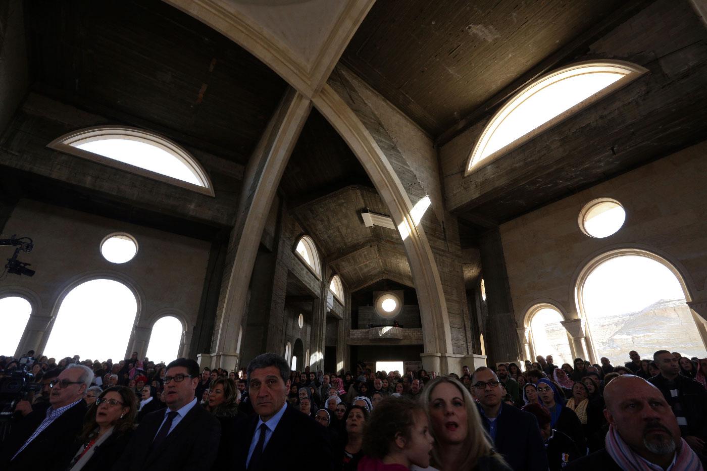 Christian pilgrims from around the world pray at John the Baptist Church near the Jordan River baptism site in South Shuna, Jordan Valley, Jordan, Friday, Jan. 11, 2019.