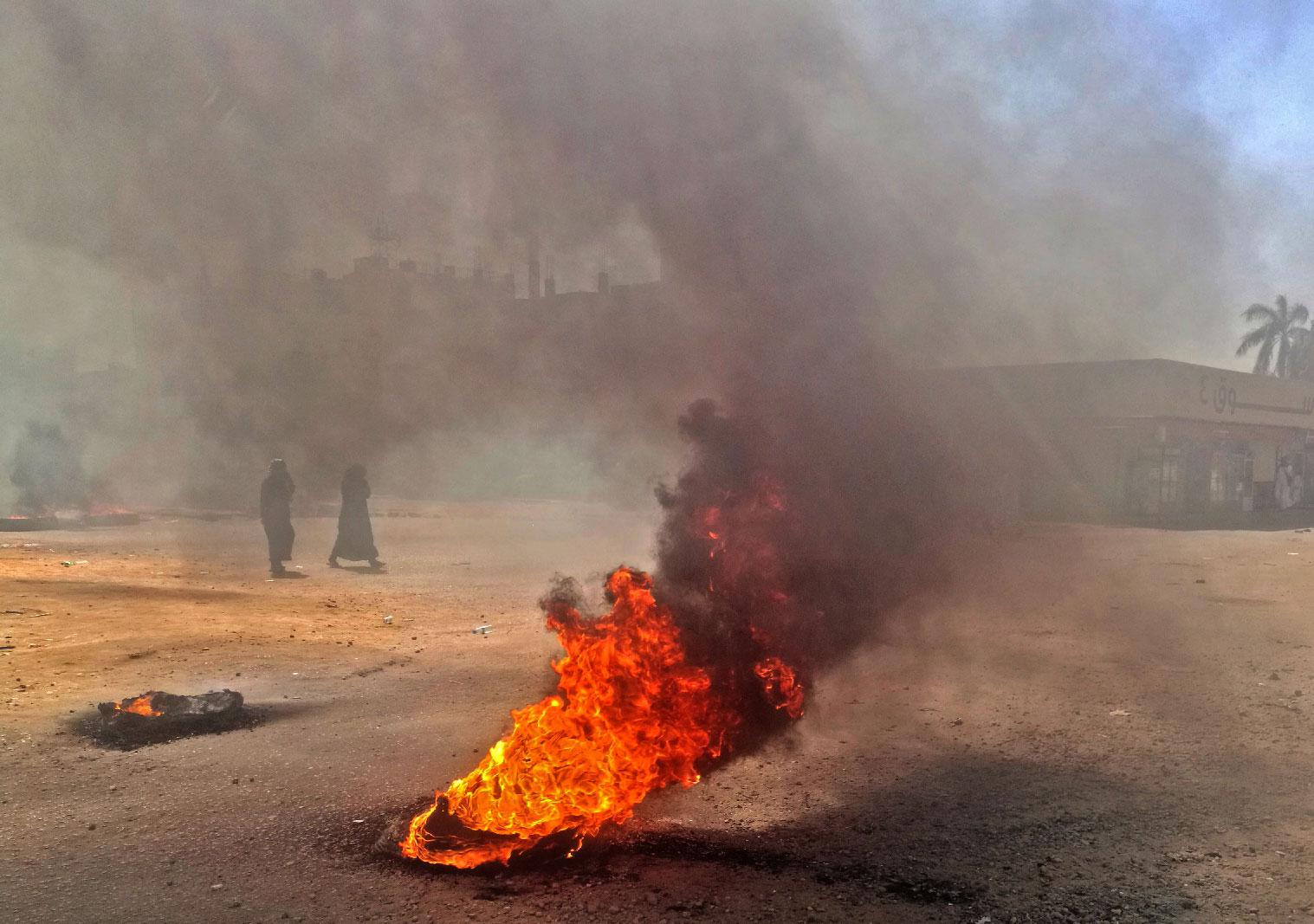 Sudanese protestors burn tires during an anti-government demonstration on January 18, 2019 in the capital Khartoum.