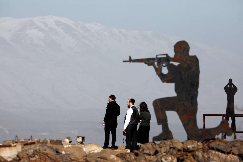 New escalation. People stand next to metal sculptures at Mount Bental, an observation post in the Israeli-occupied Golan Heights.