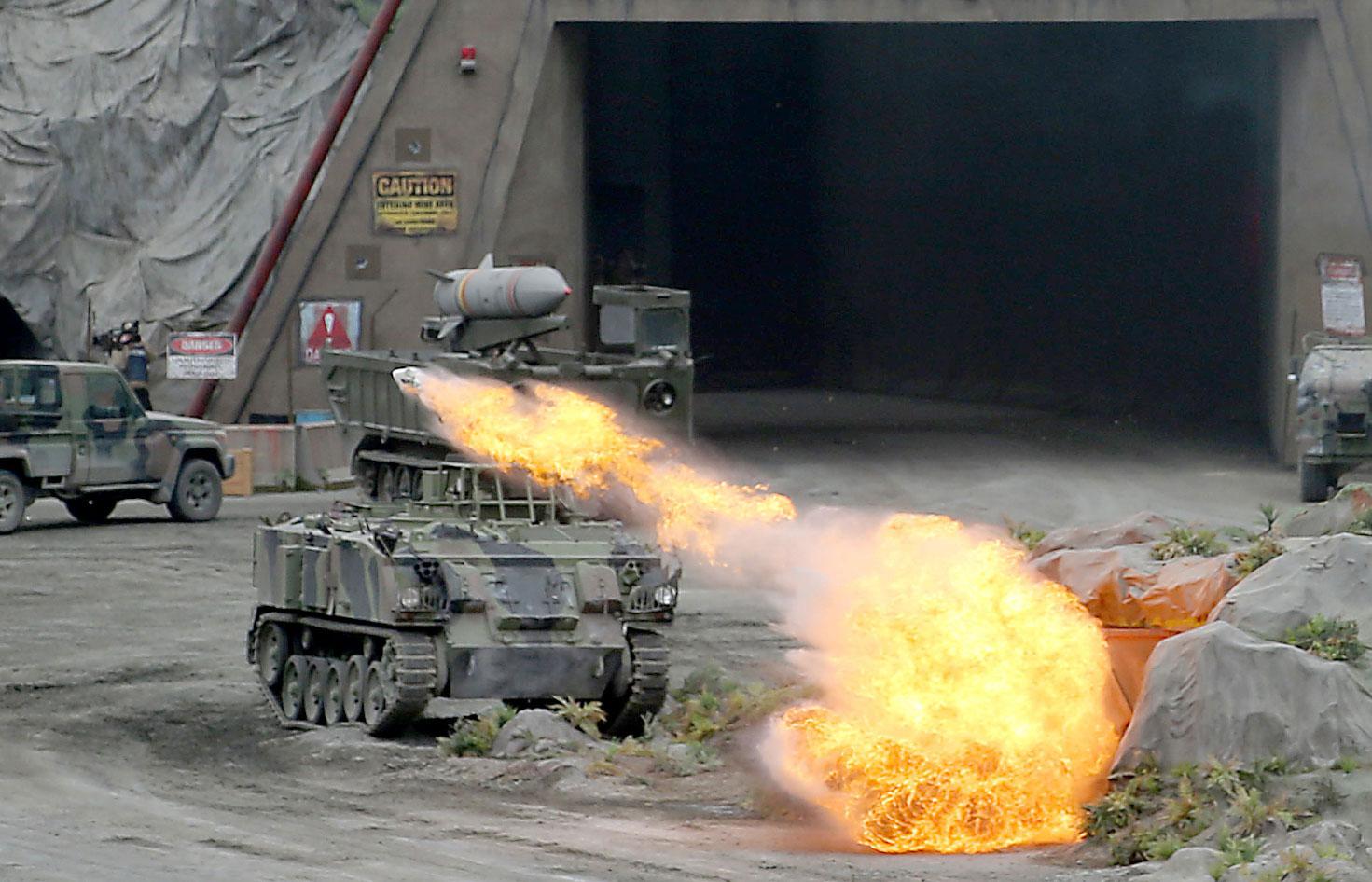 Members of the UAE Armed forces perform a military drill during the opening of the International Defence Exhibtion and Confrence at the Abu Dhabi National Exhibtion Centre on February 17, 2019.