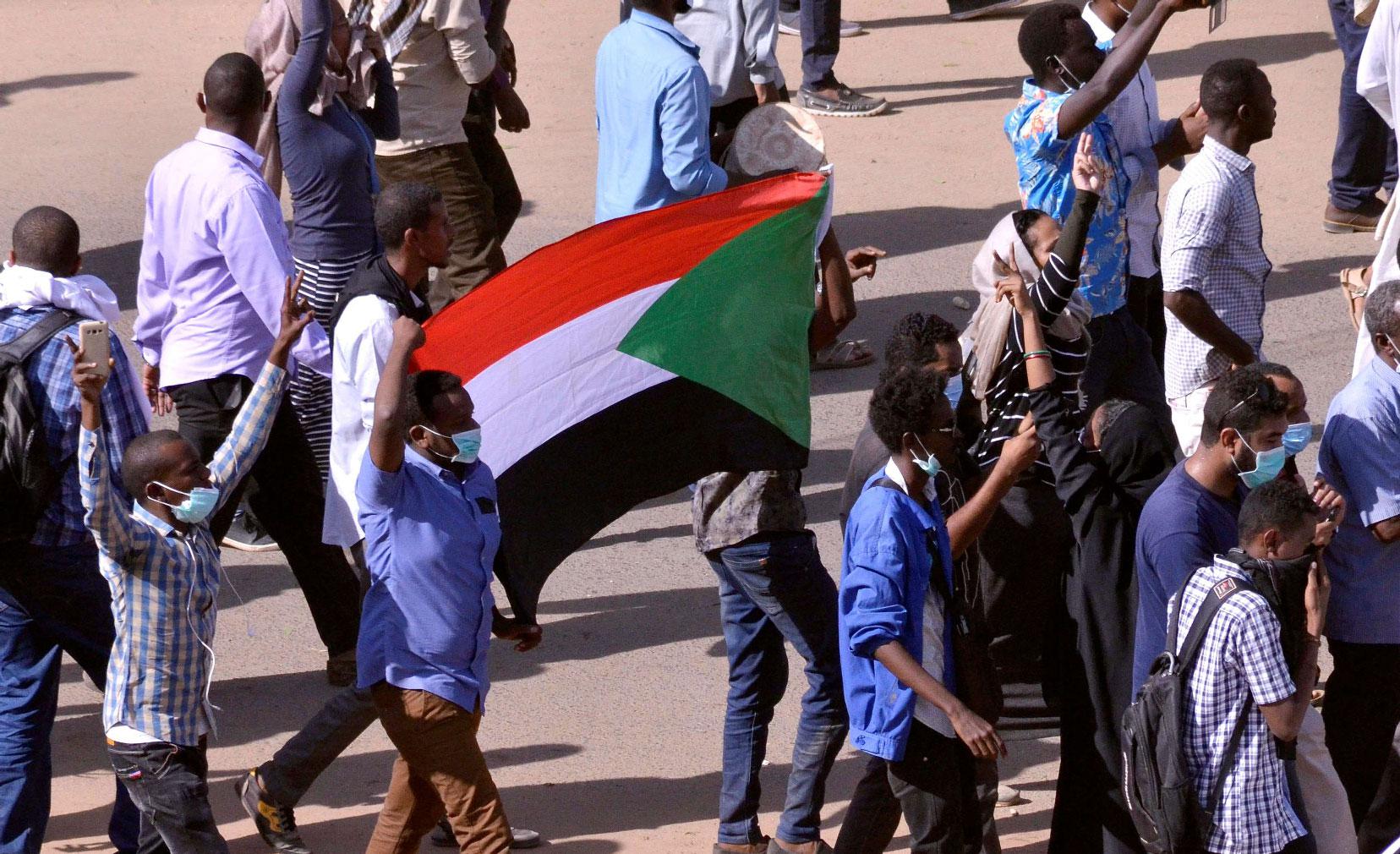 Sudanese demonstrators chant slogans as they march along the street during anti-government protests in Khartoum, Sudan December 25, 2018.