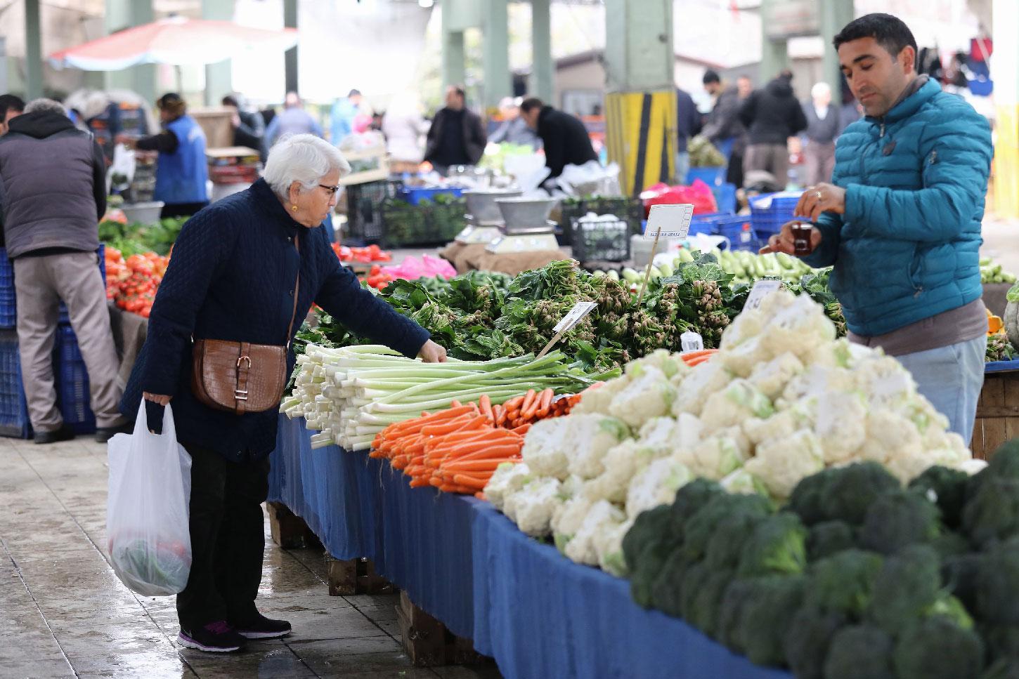 A woman shops for vegetables at a market in the Turkish capital Ankara, on February 13, 2019.