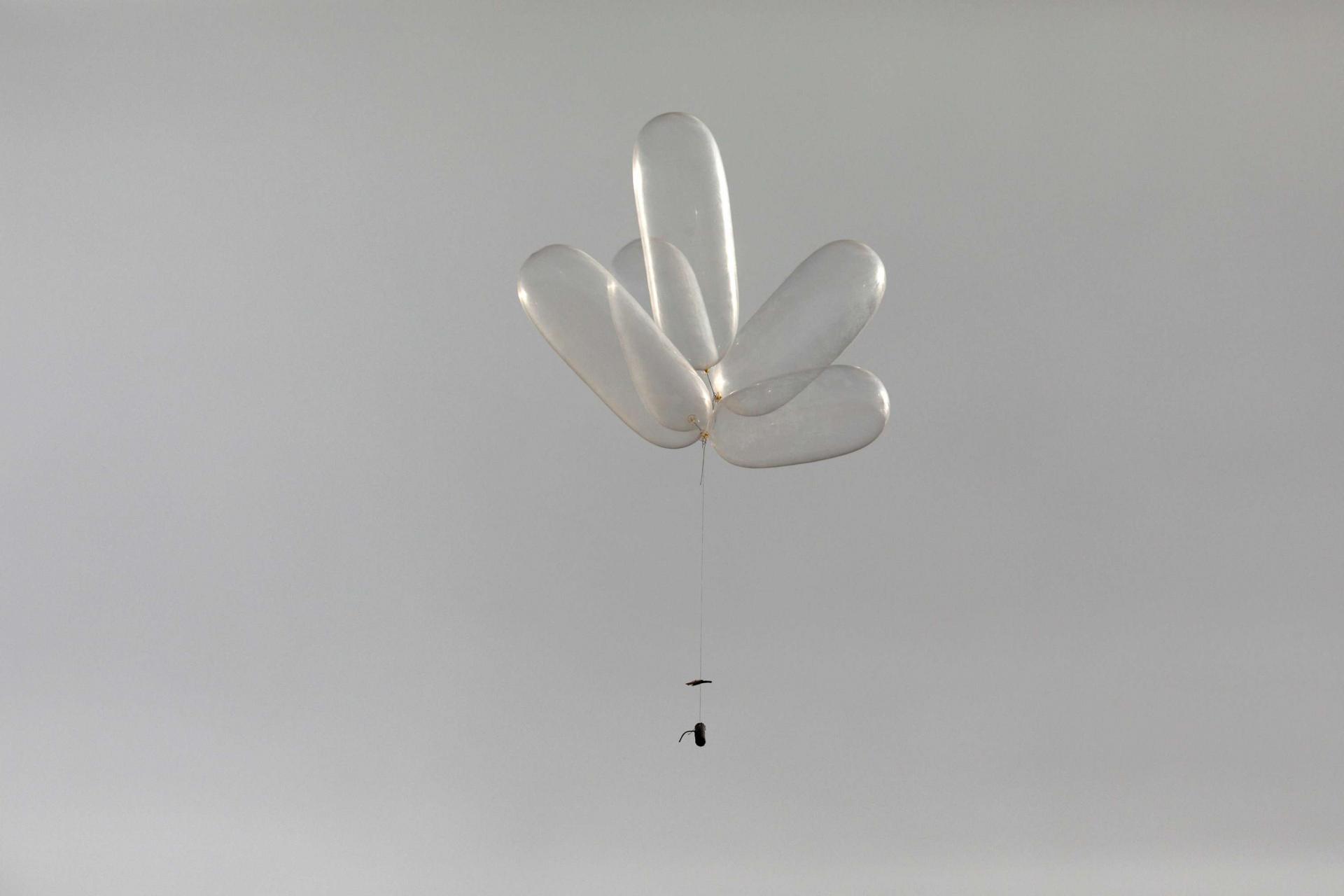 Balloons connected to a device can be seen as Palestinians protest near the fence separating the Gaza Strip on October 19, 2018.