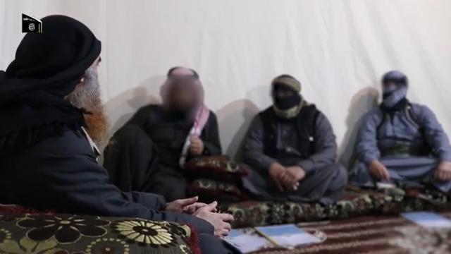 Chief of the Islamic State group Abu Bakr al-Baghdadi (1st-L) appears for the first time in five years in a propaganda video