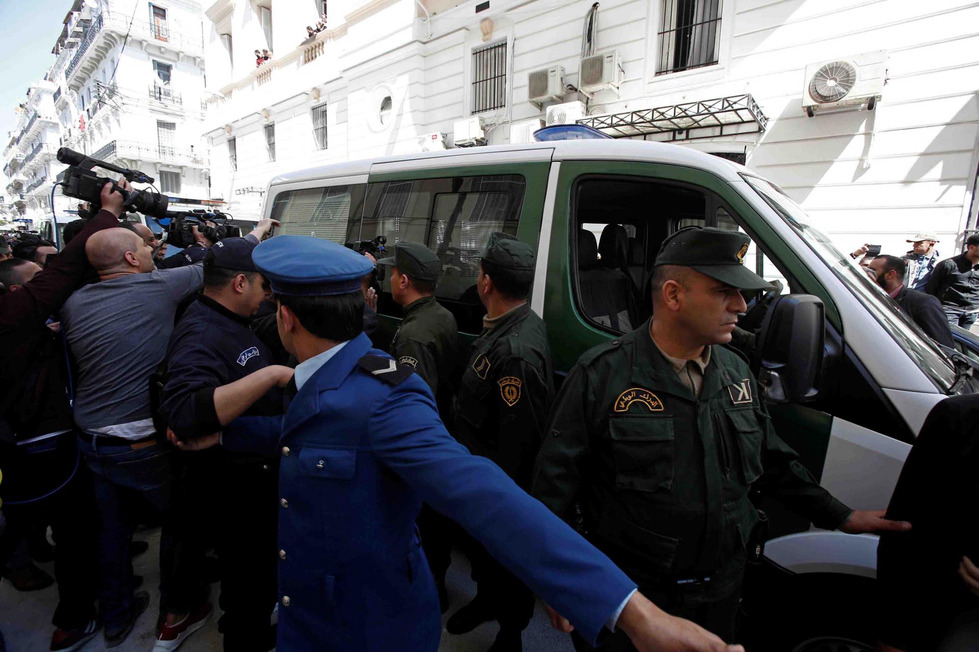 The former central bank governor is the first government official to appear before prosecutors since mass protests