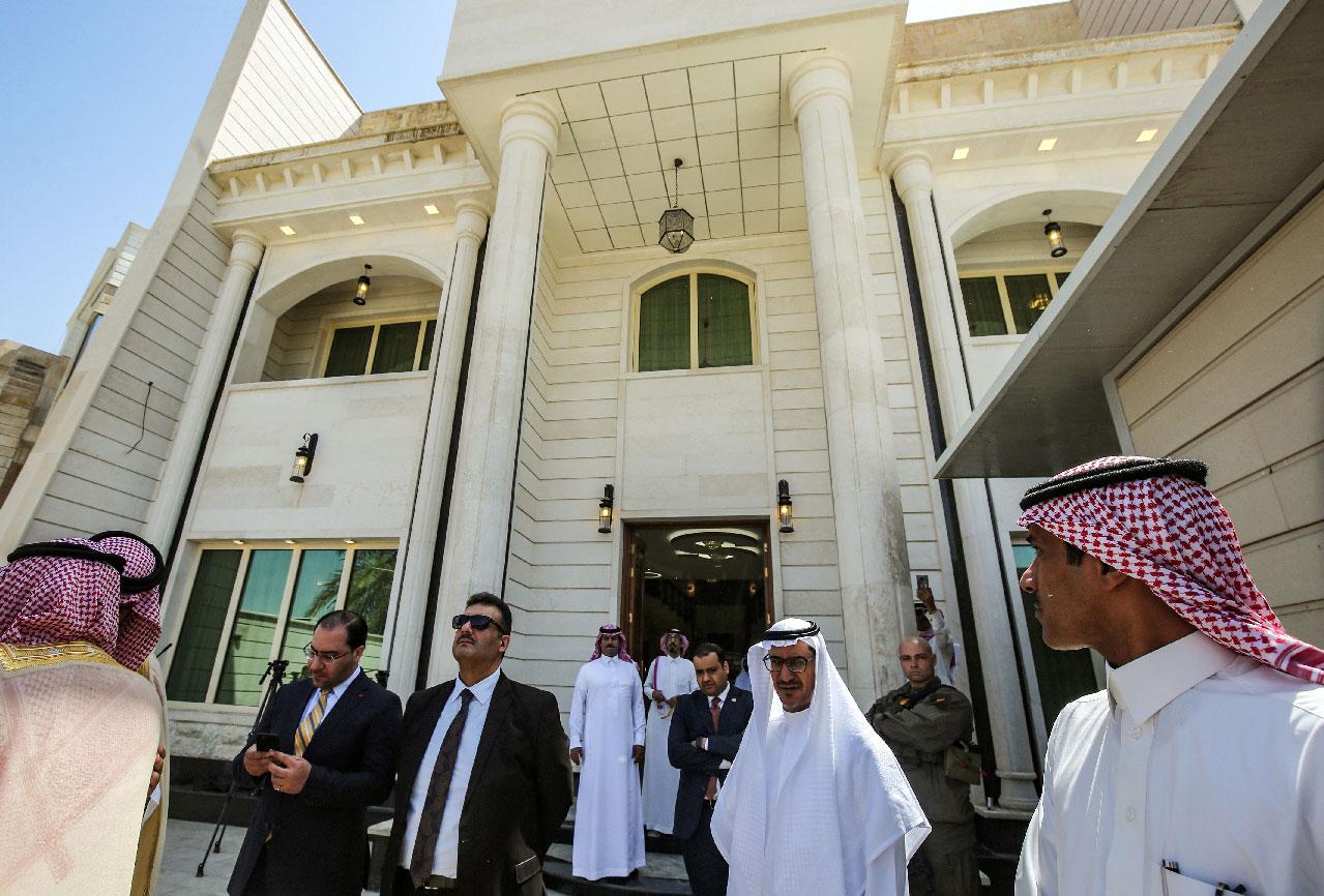 Saudi diplomatic staff are seen during the inauguration of the new Saudi consulate compound in the high security "Green Zone" in the centre of the Iraqi capital Baghdad on April 4, 2019.