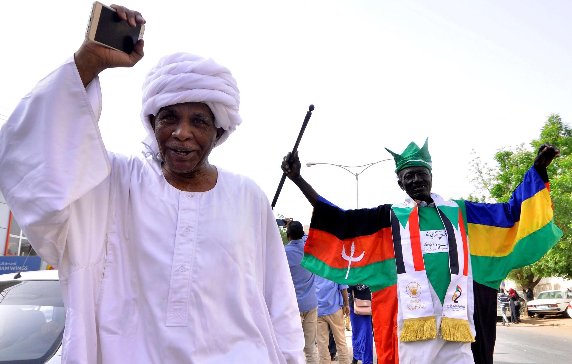 Demonstrators chant slogans along the streets after Sudan's Defense Minister Awad Mohamed Ahmed Ibn Auf said that President Omar al-Bashir had been detained "in a safe place" and that a military council would run the country for a two-year transitional period in Khartoum, Sudan April 11, 2019.