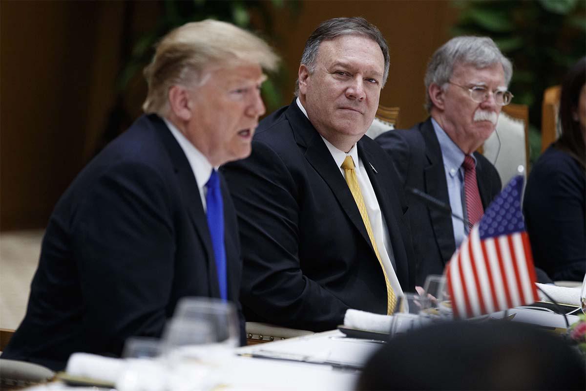 Secretary of State Mike Pompeo, center, and national security adviser John Bolton, right, listen to President Donald Trump 