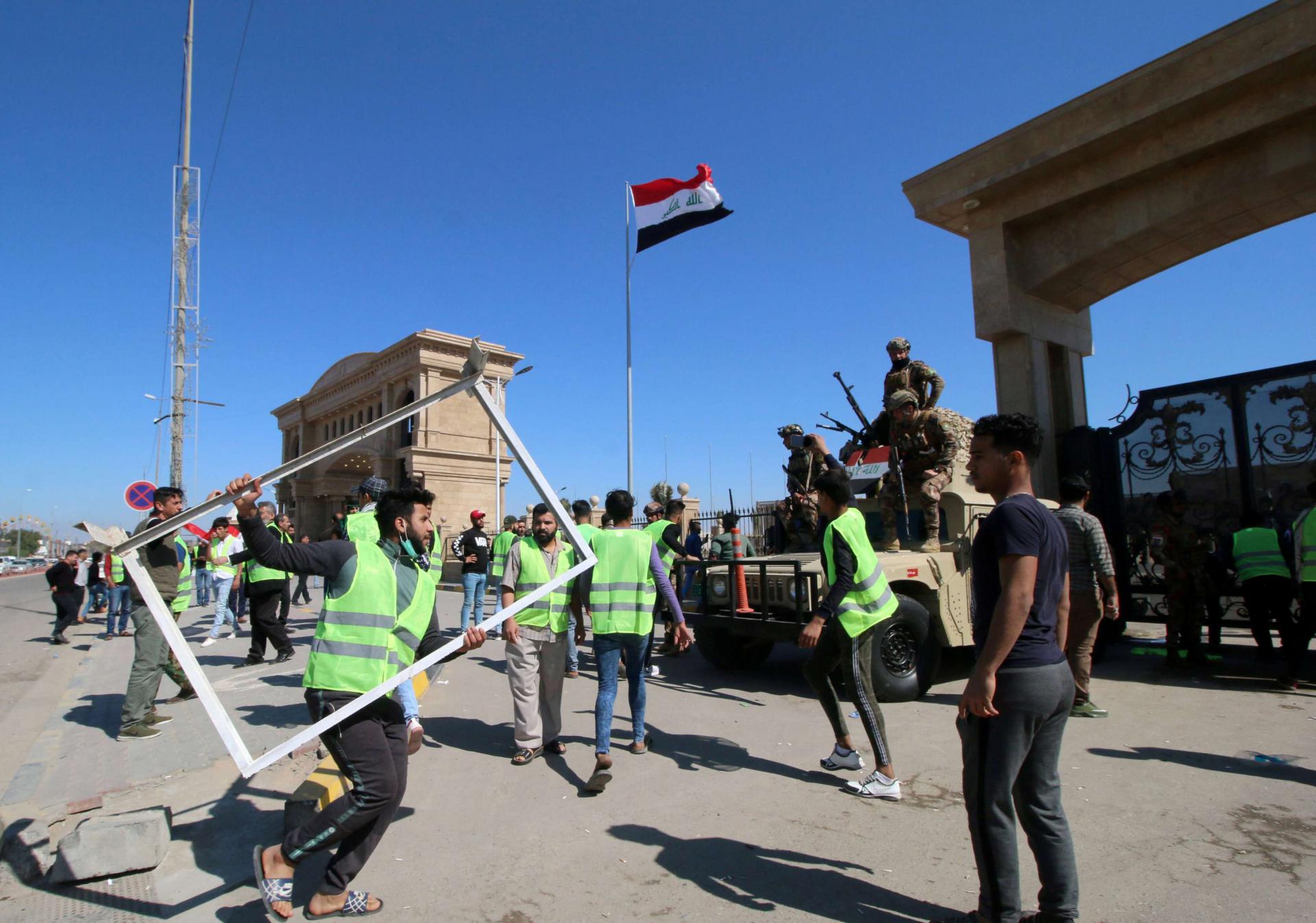 Iraqis protest near the provincial council building in Basra, last March