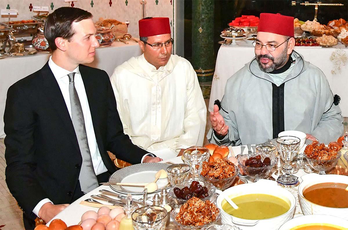 Moroccan King Mohammed VI (R) sharing an Iftar meal with Senior Advisor to US President Jared Kushner (L) at the Royal Residence in Rabat