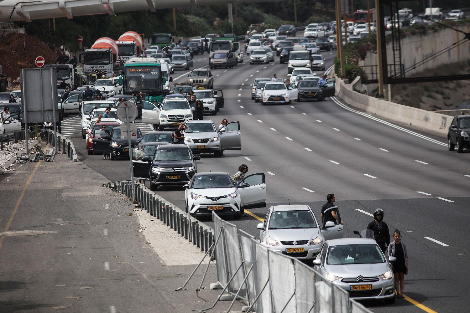 People in Tel Aviv stop and stand in silence for two minutes as sirens blared in memory of the 6 million Jews killed in the Holocaust