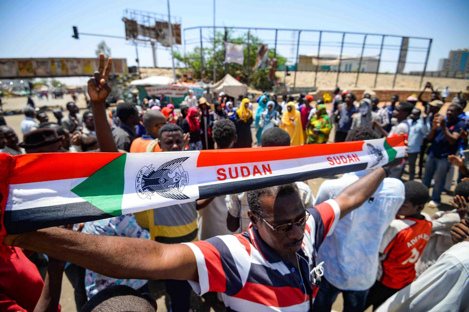 The deadly violence in and around the sit-in broke out just hours after the two sides announced they had reached agreement