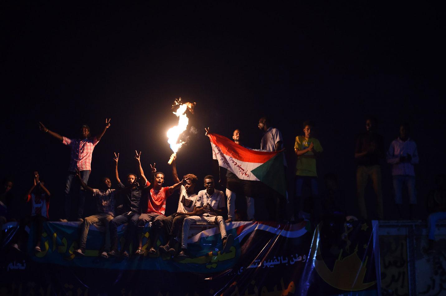 Sudanese protesters gather for a sit-in outside the military headquarters in Khartoum