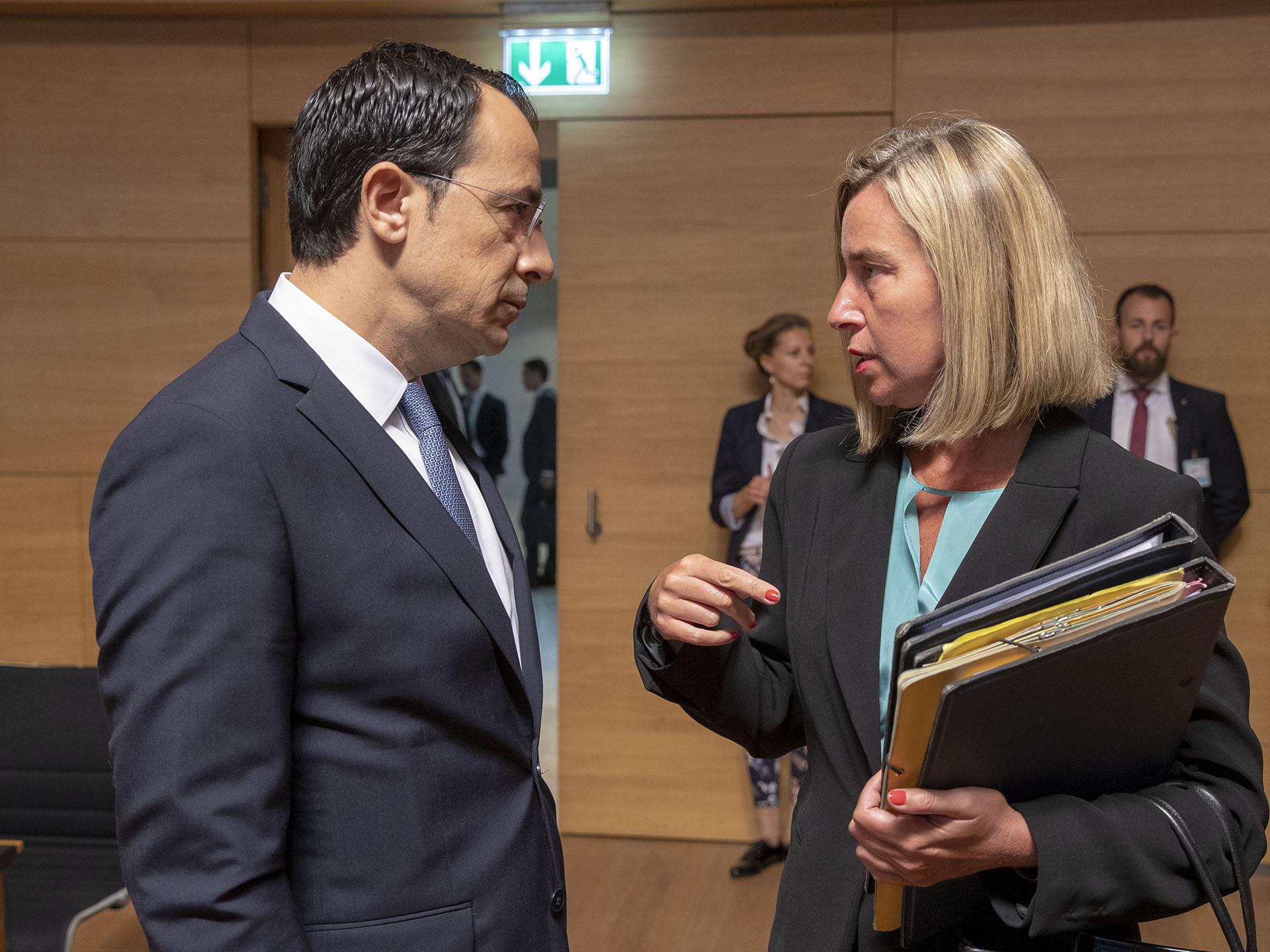 Cypriot Minister of Foreign Affairs Nikos Christodoulides (L) meets with European Union Foreign Policy Chief Federica Mogherini