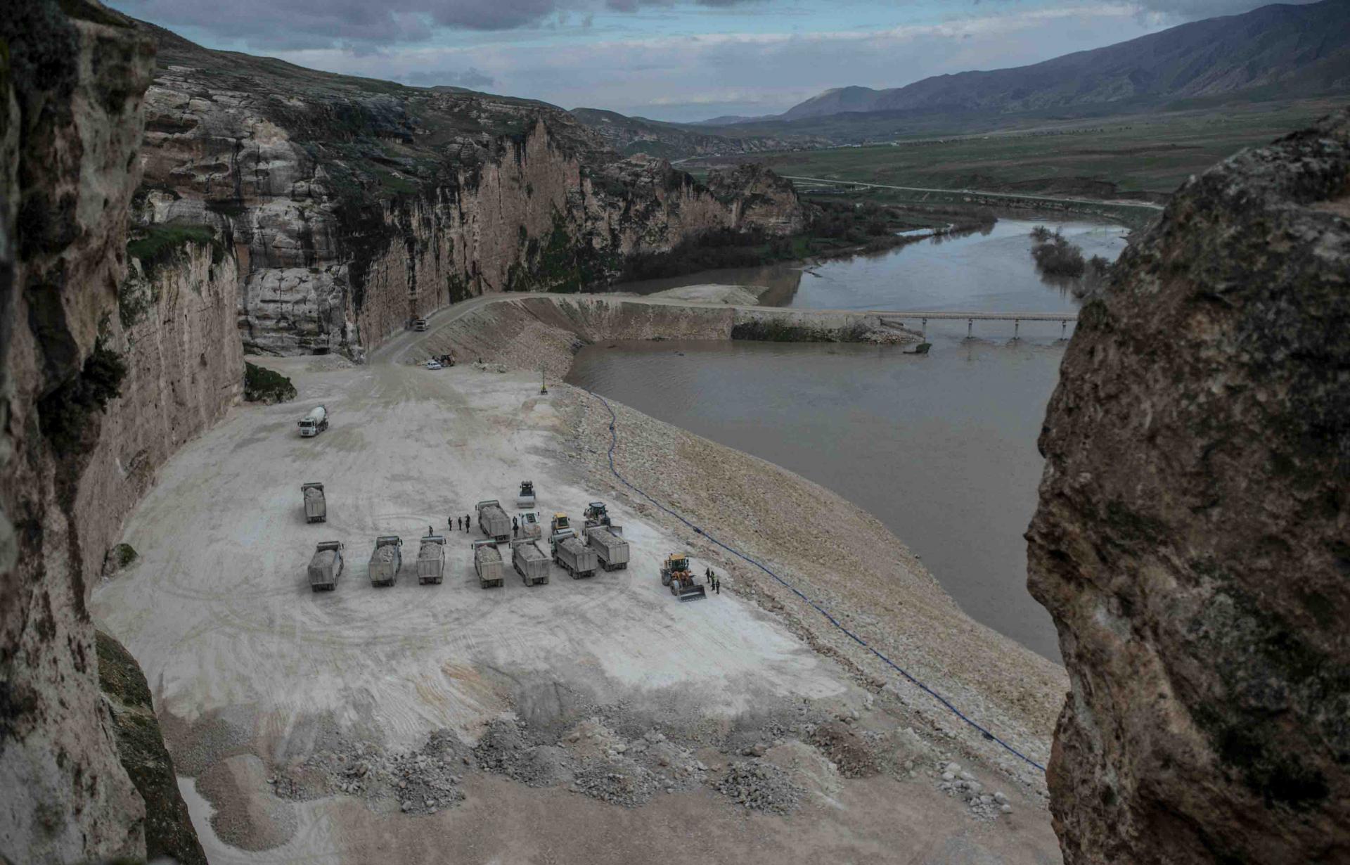 Trucks are seen on the banks of the Tigris River near Hasankeyf, last December